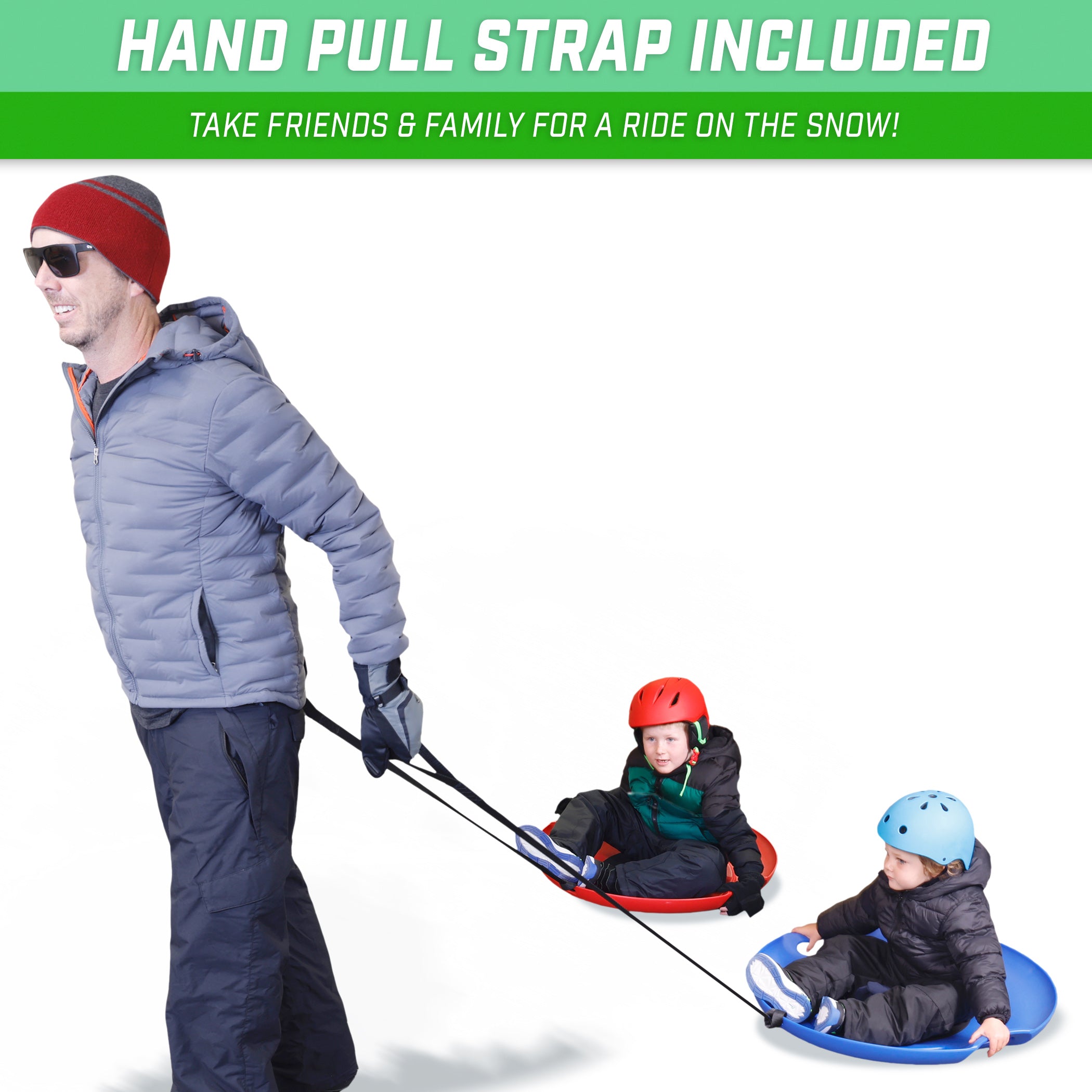 man pulling two snow saucers with two children on top of saucers