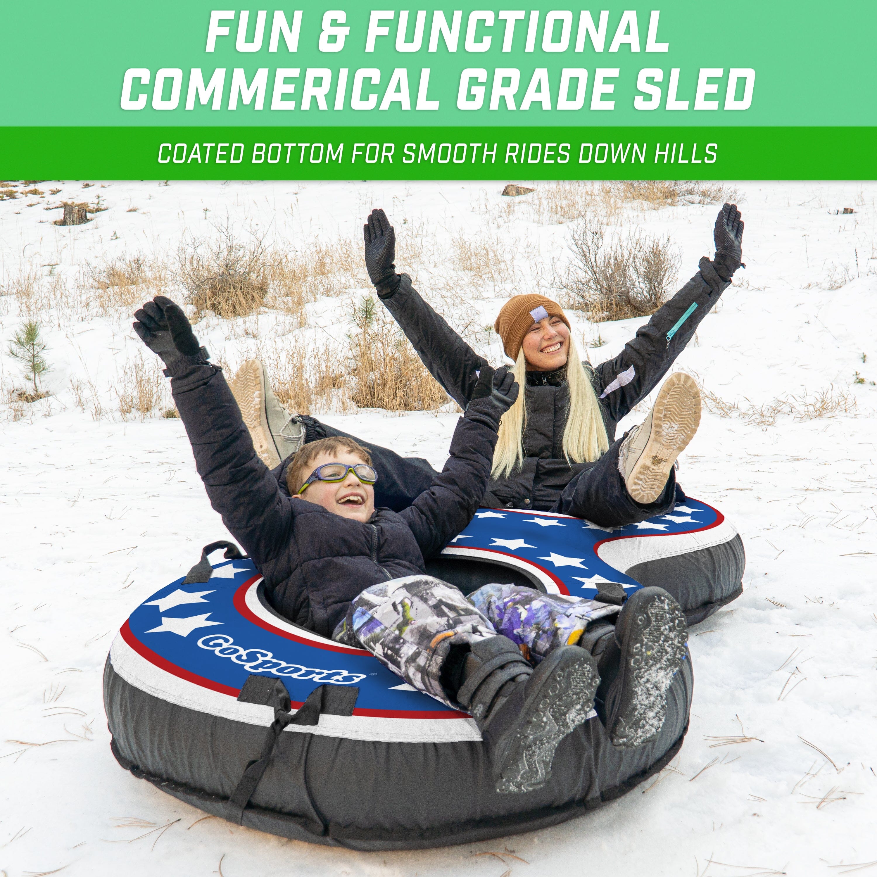 two people are sitting on a snow tube