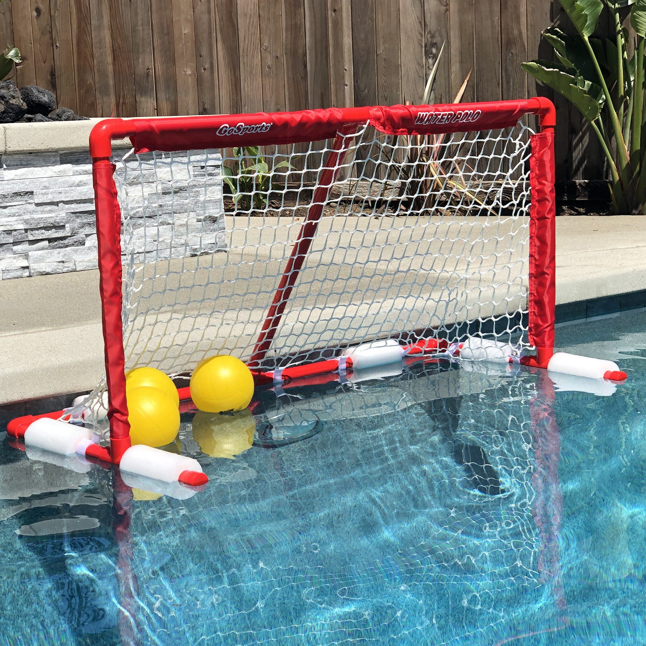 a pool with a net and balls in it