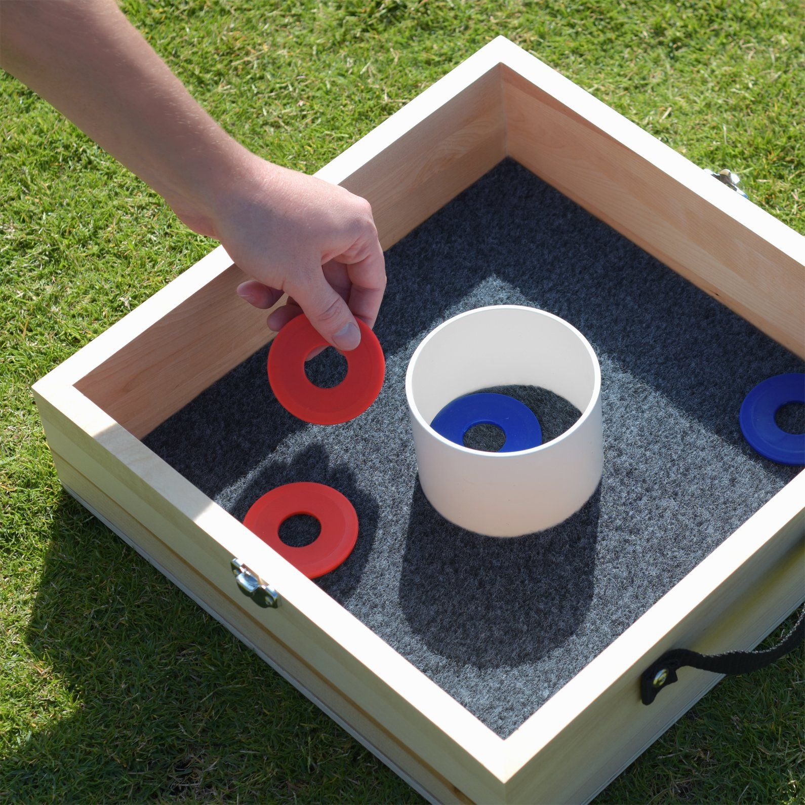 a person is playing with a sand box