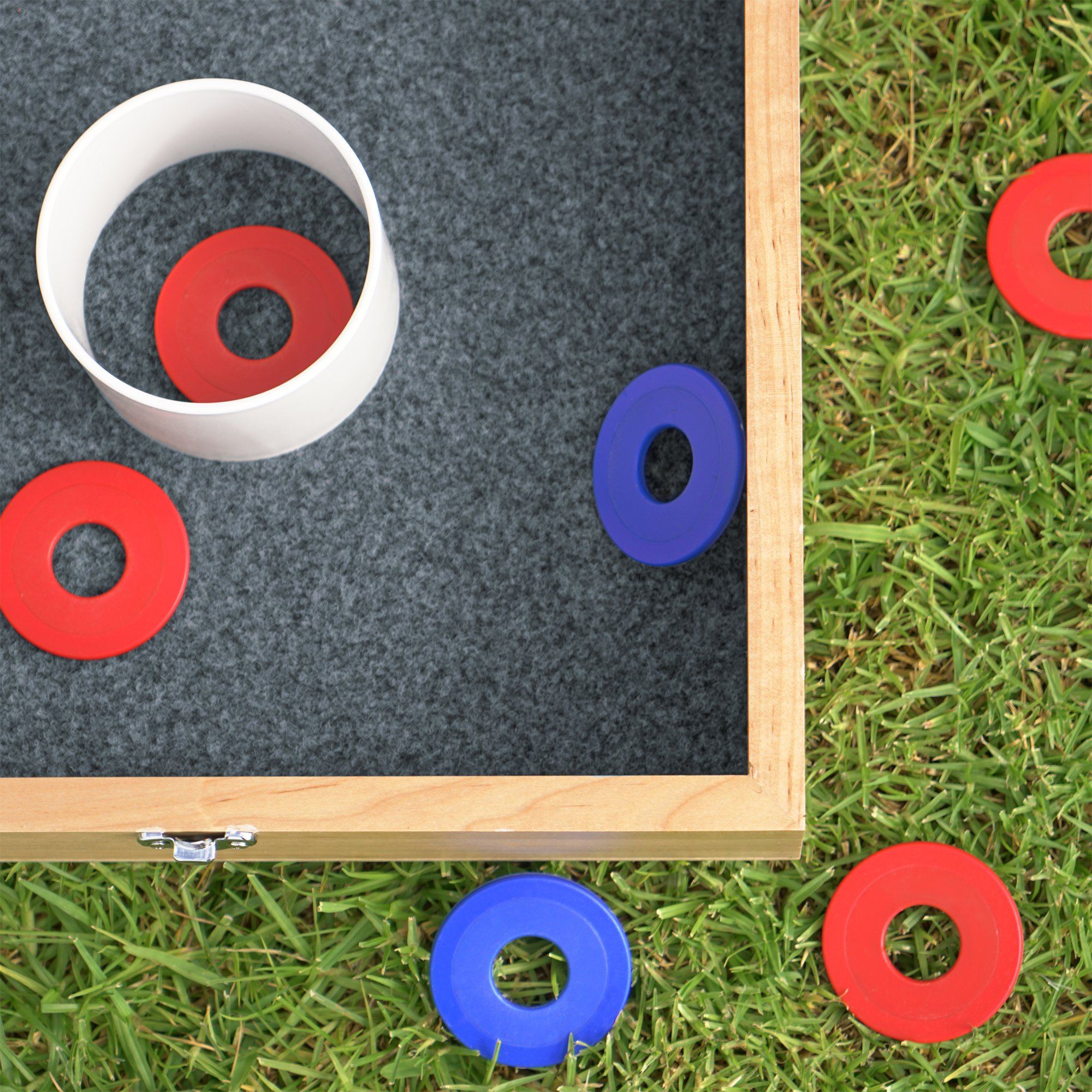 a wooden box with a white cup and red and blue circles