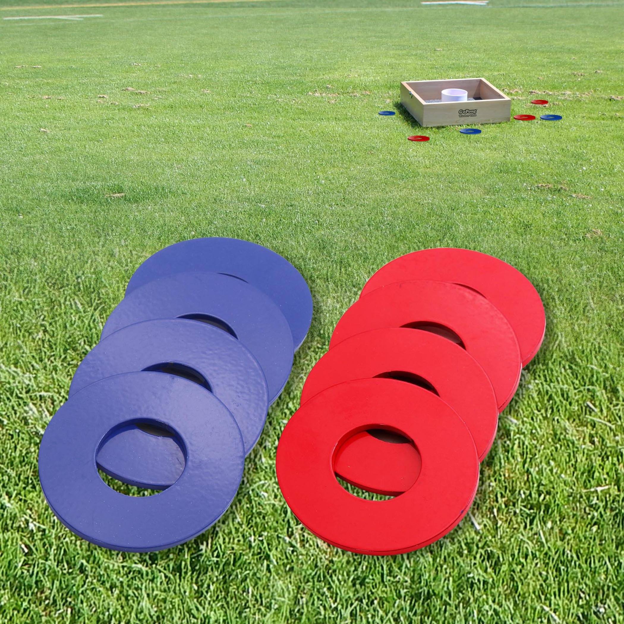 a pair of red and blue foam rings on the grass