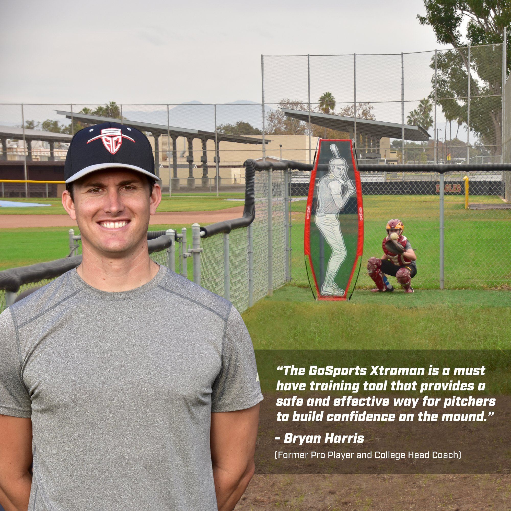 a man standing in front of a baseball field
